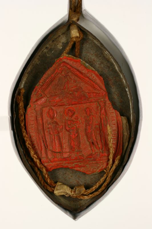 Sello pendiente de cera roja, en caja de hojalata, perteneciente a Rodrigo Pío, obispo de Portuen y cardenal de Carpo.